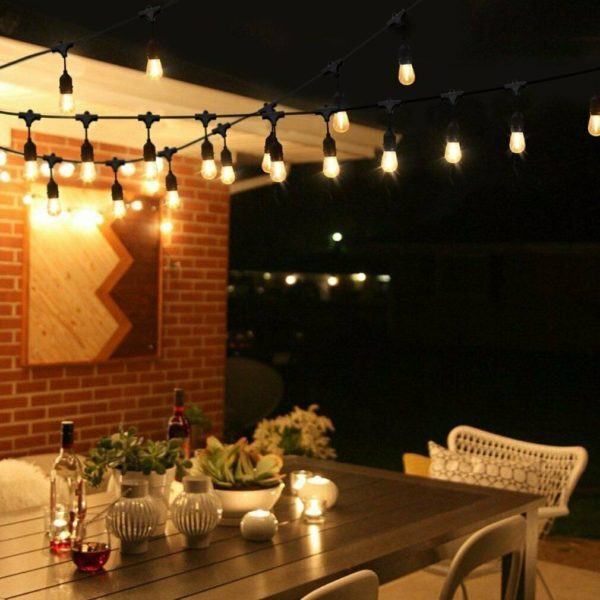 Vintage bulb string lights above a table